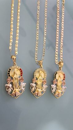 "Special for you. We offer free shipping with the purchase of 35 dollars or more! with First Class Mail (Not Priority Mail) Virgin Mary (Guadalupe Virgin) with Roses Necklace - Two Style Gorgeous Virgen de Guadalupe Pendant with Rose flowers surrounding her heavenly image! *Pendant Height: 2.75\" inches *Pendant Width: 1\" inch *14k Tricolor Gold Plated *Includes 24\" inches 5mm Figaro and Curb chain Material: Copper Measurements: Chain - 12 inch. from top to bottom (24\" Long from end to end) * Gold Mexican Jewelry, St Jude Necklace, Mary Guadalupe, Big Pendant Necklace, Latina Jewelry, Xoxo Jewelry, Mexico Jewelry, Mary Necklace, Virgin Mary Necklace