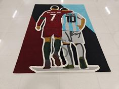 a rug with two soccer players on it in the middle of a flooring area