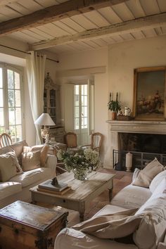 a living room filled with furniture and a fire place