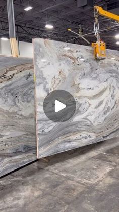 a large marble slab being worked on