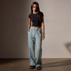 Our Wide Leg Pull-On Denim Pant has a slim fit through the hip to a wide leg hem. This Italian denim pant features patch pockets, contrast stitching, and a elastic waistband with drawcord for effortless style and comfort.Additional Information:• 100% Cotton • Machine wash cold, tumble dry low Denim Polo, Jumpsuit Skirt, Bleach Wash, Wide Leg Denim, Denim Pant, Sweater Skirt, Outerwear Jackets, T Shirt Top, Kid Shoes