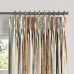 an open window curtain with multicolored stripes