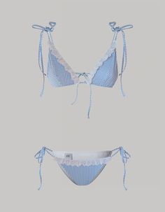 The Sophie bikini is an exquisite fusion of contemporary allure and playful elegance. The triangle bikini top and adjustable low-rise bottoms showcase a mesmerizing blue gingham pattern, adorned with Sangallo ribbon lace details. Expertly crafted from our luxurious Vichy print stretch ribbed fabric, this bikini guarantees a flattering silhouette with its padded bra for comfort. The Sophie bikini effortlessly combines fashion-forward design with classic femininity for a summer style statement.