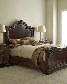 a bedroom with a large bed and two nightstands