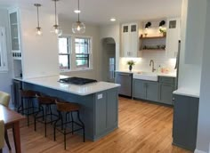 the kitchen is clean and ready to be used for cooking or eating, with an island in the middle