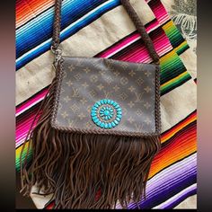 Authentic Vintage Boho Louis Vuitton. Turquoise Concho With Leather Fringe And Braid Cross Body Strap. Love This Bag But Never Carry It. Pet Free Smoke Free Home. Great Condition Boho Louis Vuitton Handbags, Bags Vintage, Leather Fringe, Vintage Boho, Louis Vuitton Bag, Cross Body, Louis Vuitton, Bag Lady, Turquoise