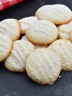 a pile of sugar cookies sitting on top of a table