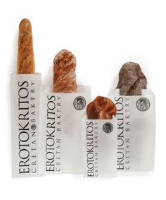 three different types of breads are on display in front of each other with labels