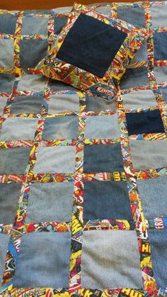 a quilt made out of old jeans on top of a bed