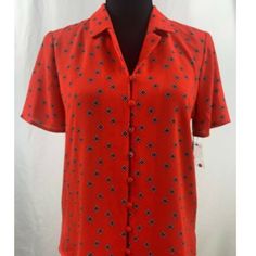 Item: Vince Camuto Women's Floral Print Shirt Material: Polyester Pattern: Floral Sleeve Length: Short Sleeve Neckline: V-Neck Size: Xxs=0 X-Large=16 Style Number: 9139132 Color(S): Crimson Red Condition: New With Tags Care:Washable Red Printed Button-up Top, Red Printed V-neck Shirt, Red Printed Short Sleeve Blouse, Red Collared Printed Blouse, Red Printed Collared Blouse, Red Short Sleeve Blouse With Button Closure, Red Printed Tops For Work, Red Printed Tops For Workwear, Floral Sleeve