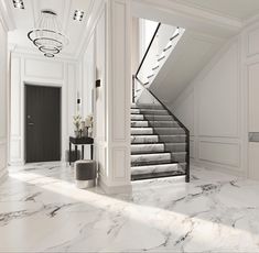 an elegant foyer with marble flooring and white walls, along with stairs leading up to the second floor