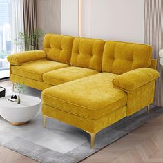 a living room with a yellow couch and white coffee table in front of a window