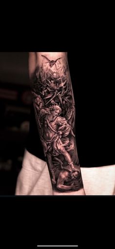 a man with a tattoo on his arm