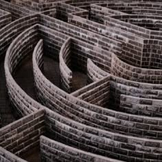 an intricate brick wall with curved sections in the center