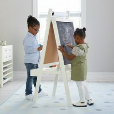 Comprised of unique storage solutions, functional work spaces and special places to curate and display children's art, the Martha Stewart Crafting Kids' Collection by Guidecraft inspires a child's artistic expression. Innovative designs along with quality pieces, together establish a comprehensive, child-centered space to create using a variety of media. Constructed from a durable combination of easy-to-clean solid pine and engineered wood, the Kids' Easel - White inspires imagination. This doub Kids Art Storage, Kids Art Easel, Eraser Art, Paint Cups, Kids Easel, Art Easel, Wooden Easel, Unique Storage, Painted Cups