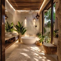 a bathroom with two sinks and a bathtub surrounded by greenery in the sunlight