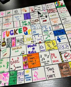 a close up of a board game on a table with many different colored letters and numbers