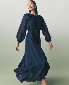 With cascading ruffles and a tied waist, this diaphanous maxi dress takes style routines in a dreamy direction. Gathered round neck. Long blouson sleeves with elasticized cuffs. Removable tie belt. Back button keyhole. Lined. Outfits for at work. Endless office outfits for your M-F by Ann Taylor.