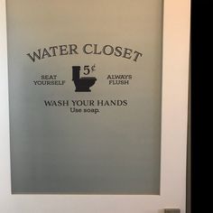 a bathroom door with a sign that says water closet