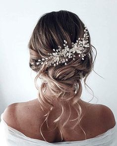 a woman wearing a bridal hair comb