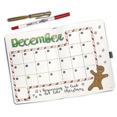 a christmas calendar with a gingerbread on it and a red pen next to it