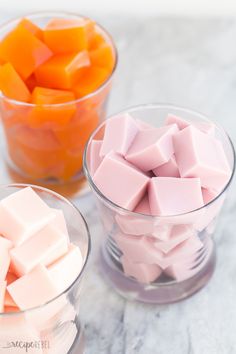 three bowls filled with different colored marshmallows