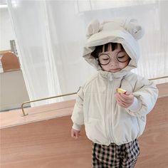 Introducing our Hooded Puffer Bear Jacket, the perfect blend of warmth, style, and cuteness for your little ones. This jacket is not just a winter essential; it's a delightful fashion statement that will make your child the star of any outing. The standout feature is the lovable bear design on the hood, complete with fuzzy bear ears, adding an element of charm that kids adore. Playful Hooded Outerwear With Adjustable Hood, Playful Hooded Outerwear For Cold Weather, Cute Outerwear With Fleece Lining For Cold Weather, Playful Hooded Outerwear For Playtime, Cute Outerwear With Fleece Lining For Winter, Cute Winter Outerwear With Fleece Lining, Cute Hooded Outdoor Outerwear, Cute Hooded Outerwear For Outdoor, Hooded Outerwear With Fleece Lining For Playtime