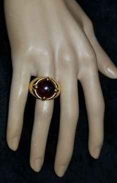 GORGEOUS VINTAGE ITALIAN DESIGN 18K YELLOW GOLD GARNET RING CENTER NATURAL RED GARNET IN ROUND CABOCHON SHAPE WEIGHT 9.57CARAT SIZE 14.5 GORGEOUS RED GARNET CLEAN ,VERY NICE CUT ,LIVELY STONE.NICE LUSTER. RING size 7.5 Ring weighs 12.7 grams Retail value $7,500 net . Appraisal available Classic Yellow Gold Ruby Cabochon Ring, Classic Yellow Gold Cabochon Ruby Ring, Formal Cabochon Ruby Ring, Classic Gold Ruby Cabochon Ring, Classic Gold Ruby Ring With Cabochon, Classic Domed Ruby Ring For Formal Occasions, Gold Ruby Ring With Domed Shape, Gold Domed Ruby Ring With Gemstone, Classic Formal Dome Ring With Cabochon