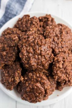 a white bowl filled with chocolate oatmeal cookies