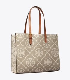 T Monogram Contrast Embossed Tote: Women's Designer Tote Bags | Tory Burch Timeless Monogram Canvas Bag For Everyday Use, Timeless Monogram Canvas Shoulder Bag For Everyday, Timeless Everyday Monogram Canvas Shoulder Bag, Classic Shoulder Bag With Double Handle And Embossed Logo, Travel Tote Bag With Monogram Print, Beige Monogram Canvas Bag With Monogram Print, Classic Signature Coated Canvas Tote Shoulder Bag, Beige Monogram Print Travel Bag, Classic Coated Canvas Tote Shoulder Bag