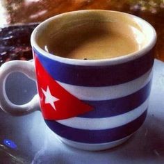 a coffee cup with a flag painted on it