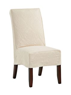 a white chair that is upholstered with a cover on it's back