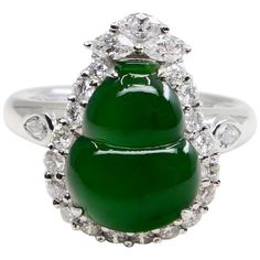 Here is an intense green Jade, very borderline true imperial jade color. This jade and diamond cocktail ring has a mystic subtle glow. It is certified by 2 labs The jade gourd represents the Fulu double, it protects people's happiness. It also means "financial resources are rolling". This vintage ring is set in 18k white gold and diamonds. We estimate the near colourless pear, marquis and round shaped diamonds in this ring setting total about 1.25 cts. The untreated / un-enhanced natural jade has a nice saturation of intense green color. This is one of those rings that you would notice across the room at a party. The ring is stunning. Not only is the green intense and dense, the subtle glow is mesmerising. Photos does not do this ring justice. A collector would want this piece for their co Imperial Jade, First Wedding Anniversary Gift, Jade Color, Spinel Ring, Diamond Cocktail Ring, Lucky Bracelet, Gold Cocktail Ring, Gold Cocktail, Diamond Cocktail Rings