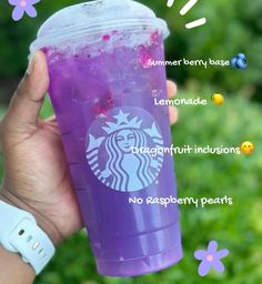 a hand holding a purple starbucks cup with information about the drink and its ingredients on it