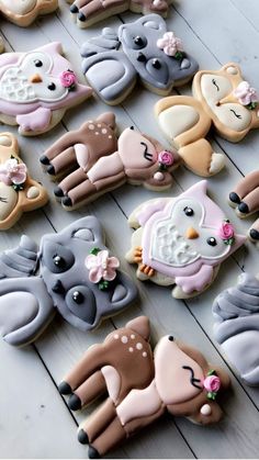 many decorated cookies are arranged on a table