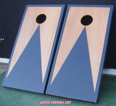 two blue cornhole boards sitting next to each other