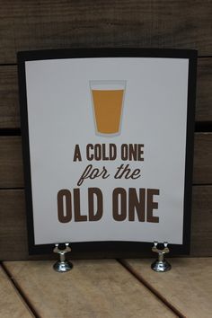 a sign that says, a cold one for the old one with a pint of beer