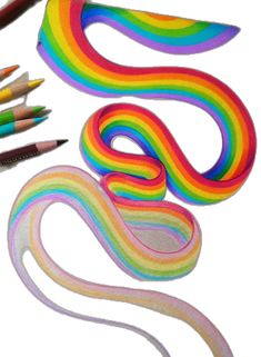 several different colored pencils next to each other on a white surface with the colors of the rainbow