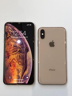 two iphones side by side on a white surface