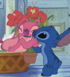 stitch and lil the little mermaid kissing in front of a basket with flowers on it