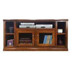 a wooden entertainment center with glass doors and bookshelves on the bottom shelf is shown