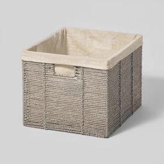 an empty wicker basket on a grey background