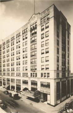 an old black and white photo of a large building