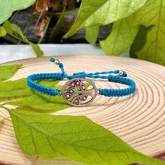 Add a touch of boho charm to your outfit with our Tree of Life Charm Macrame Bracelet. This beautifully crafted stackable friendship bracelet features a simple yet elegant design that will complement any style. Handmade using high-quality nylon thread, this bracelet is durable and comfortable to wear all day long. The Tree of Life charm symbolizes growth and strength, making it the perfect accessory for anyone looking to embrace their inner power. Whether you wear it alone or stack it with other Bohemian Braided Friendship Bracelets With Adjustable Length, Silver Bohemian Beaded Bracelets With Macrame, Bohemian Silver Macrame Beaded Bracelets, Hippie Braided Bracelet As A Gift, Bohemian Macrame Friendship Bracelets As Gift, Bohemian Friendship Bracelets With Adjustable Length, Bohemian Macrame Bracelets As Gift, Bohemian Macrame Bracelets For Gifts, Bohemian Adjustable Cord Jewelry For Friendship