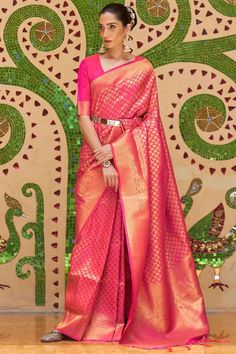 Women's Silk Blend Pink Woven Design Celebrity Saree With Blouse Product Features: Saree Color: Pink Blouse Color: Pink Saree Fabric: Silk Blend Blouse Fabric: Silk Blend Saree Type: Banarasi Saree Work: Tassels and Latkans Saree Pattern: Woven Design Saree Print : Floral Blouse Print Or Pattern: Woven Design Saree Border: Woven Design Saree Discription: 5.5 mtr saree And 0.8 mtr blouse Package Contain: 1 Saree 1 Blouse Wash: Dry Clean Occasion: Traditional/Festive Product: Silk Saree Disclaimer One Minute Saree, Hot Pink Weddings, Handloom Fabric, Perfect Blouse, Readymade Saree, Ethnic Looks, Casual Saree, Dress Indian, Kanjivaram Sarees