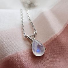 Be special with our opal diamond necklace! Opal pendant is made in a delicate and minimalist style. Please choose the material and length from the drop down menu. In case if you prefer other shape or different gemstone - feel free to contact me, I will be happy to create custom genuine opal necklace .✨ Product details: Gemstone: Opal Measurements: 9x6mm Shape: Pear Material: 14k gold/Silver Total weight: 1.6g Additional diamond: Size: 1.25mm Carat weight: 0,0075ct 🛠Handcrafted with love from ou Dainty Moonstone Teardrop Pendant Necklace, Delicate Teardrop Moonstone Necklace, Necklace Product, Necklace Opal, Rose Gold Diamond Ring, Moonstone Necklace, Pear Diamond, Moonstone Pendant, Necklace Dainty