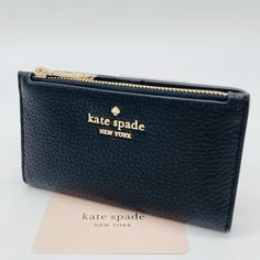 Brand New With Tag Kate Spade Leila Small Slim Bifold Wallet Details Color: Black 3.1" H X 5.5 Wx 0.9" D Pebbled Leather Metal Pinmount With Spade Logo Two Way Spade Jacquard Lining 5 Credit Card Slots, Id Window, 2 Slip Pockets Exterior Top Zip Coin Compartment On Front Of Wallet Snap Closure Dust Bag Not Included Imported Style # Wlr00395 Kate Spade Wallet Pink, Spade Logo, Kate Spade Card Holder, Kate Spade Cameron Street, Canvas Wallet, Large Wallet, Leather Card Case, Kate Spade Wallet, Zip Wallet