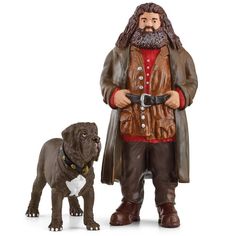 a figurine of a man with a beard standing next to a brown dog