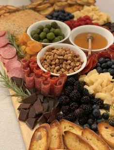 an assortment of snacks are arranged on a board