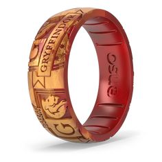 a red ring with gold lettering on it